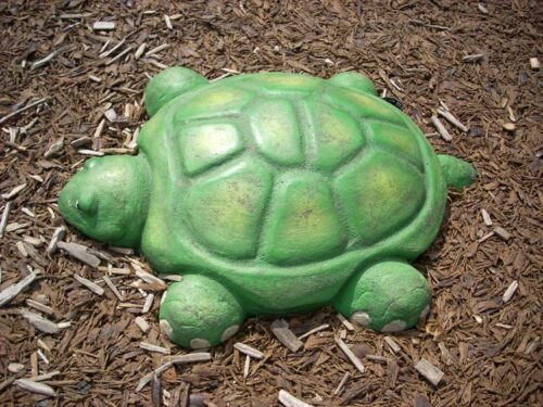 Land turtle stepper painted bright green and 4 inches tall and 24 inches wide