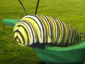 Illustration of larger than life caterpillar that is yellow
