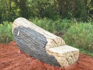Realistic looking log that ramps upwards and provides a balance and agility challenge to kids on the playground